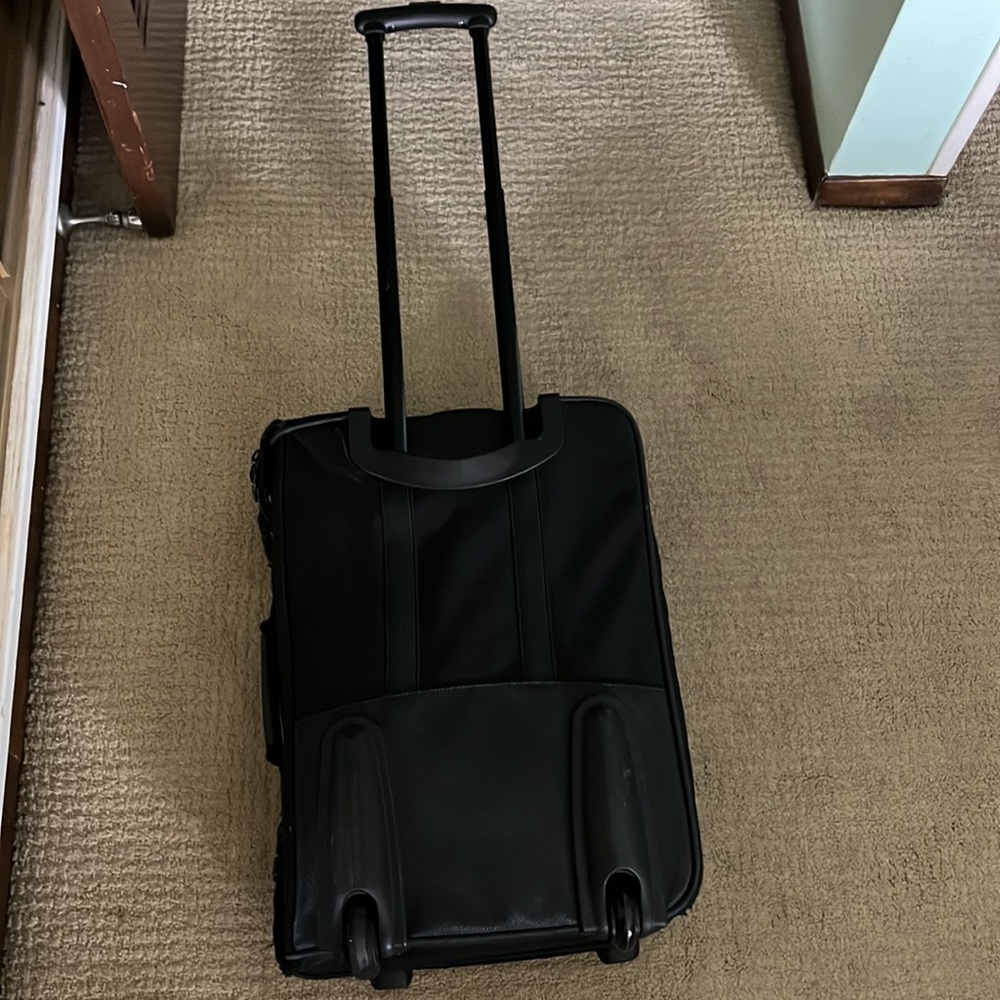 American Tourister black carry-on luggage